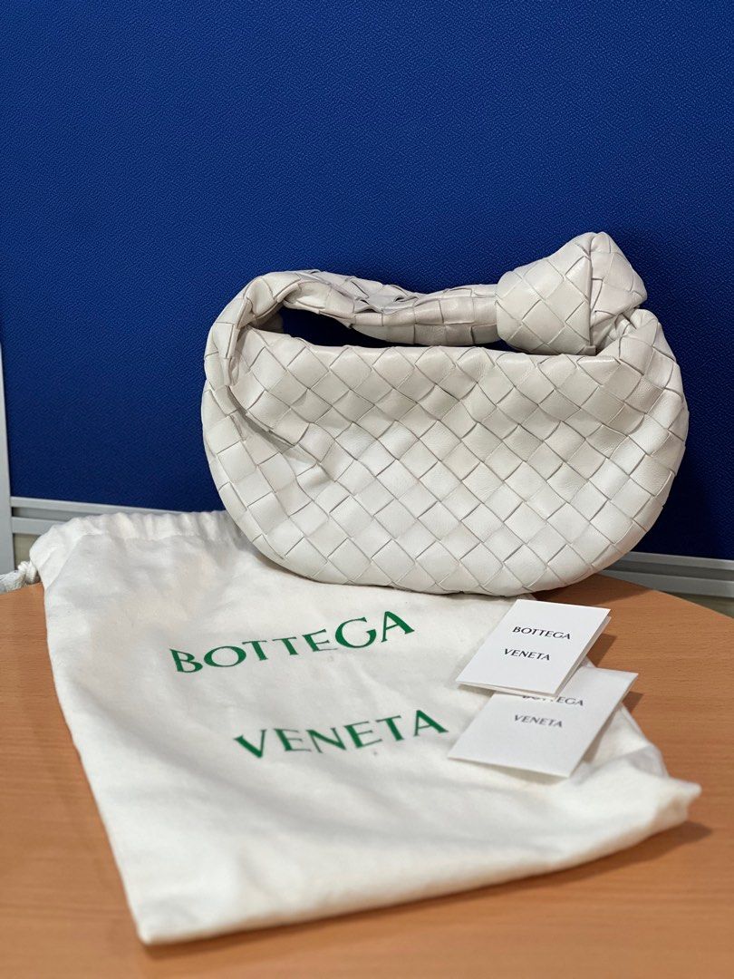 Bottega Veneta Jodie Mini (White) (Category: Luxury Bags & Wallets) located in Makati City. Submitted by Chimochi (Listing ID 1441710292, Image 1). Description: BV Jodie Minis White Authentic Minor discoloration in handle due to usage but can be cleaned professionally Last price. No to lowballers.