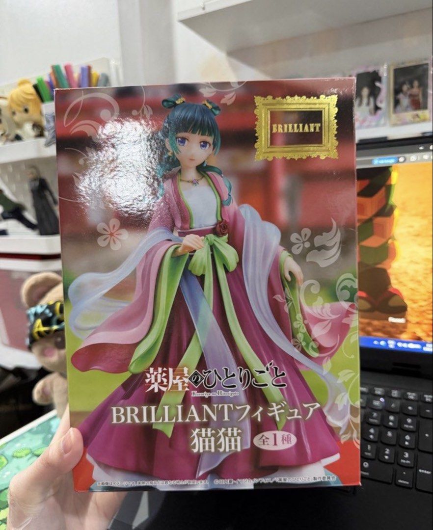 Brilliant Figure Maomao Figure (Category: Figurines & Statues) located in Santo Tomas. Submitted by snickersbns (Listing ID 1441753136, Image 1). Description: - Brilliant Figure Cat Cat anime figure - Features a character in a traditional Chinese-inspired outfit - Pink and green flowing robes - Box includes Japanese text - 'BRILLIANT' text in gold on the box - Ideal for anime figure collectors.