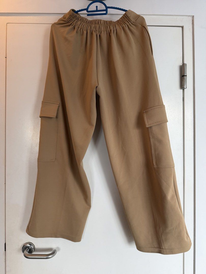 Cargo pants in khaki (Category: Bottoms) located in Singapore. Submitted by SXHXFXQXH (Listing ID 1441643168, Image 3). Description: Cargo pants in khaki. From adorn, wore once only. Letting go at $10. Can fit up to 2xl.