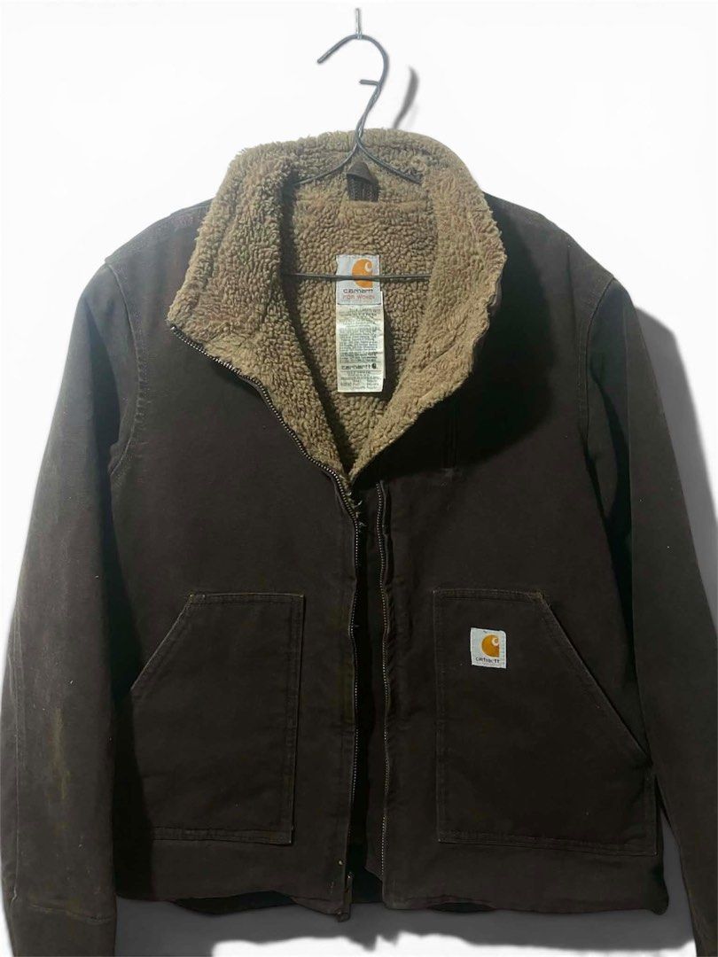 Carhartt Sherpa Lined Detroit Jacket (Category: Coats, Jackets and Outerwear) located in Lucena. Submitted by zhildaze (Listing ID 1441735545, Image 1). Description: - Classic Carhartt jacket - Dark brown canvas exterior - Warm sherpa lining for comfort - Zip-up front closure - Two front pockets - Iconic Carhartt logo patch on chest pocket - Ideal for cooler weather.