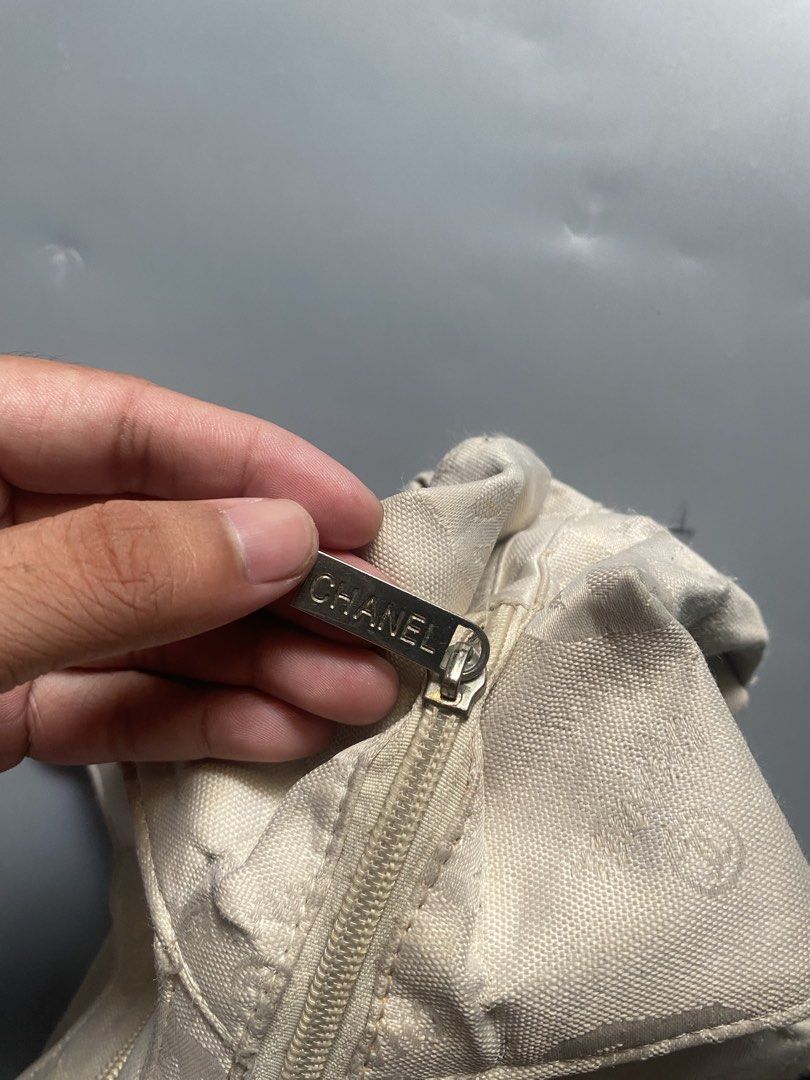 Chanel Canvas Monogram Shoulder Bag (Category: Luxury Bags & Wallets) located in Manila. Submitted by thriftwhoop (Listing ID 1441592207, Image 3). Description: - Authentic Chanel cream canvas shoulder bag - All-over CC and Chanel logo pattern - Silver hardware with Chanel zipper pull - Two main zippered compartments - Handles show some signs of wear - Interior is clean - Perfect classic piece for everyday use.