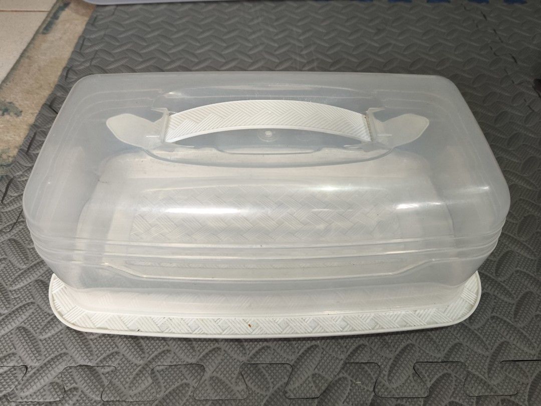 Clear Plastic Cake Carrier and Stackable Storage Bins (Category: Storage Boxes & Baskets) located in Caloocan City. Submitted by wadam9 (Listing ID 1441645609, Image 1). Description: - Clear plastic cake carrier with secure white base and lid. - Includes 6 stackable white storage bins. - 2-1 (take all) - Ideal for transporting cakes and pies. - Great for organizing kitchen or craft supplies. - Bins can be stacked together or used individually..