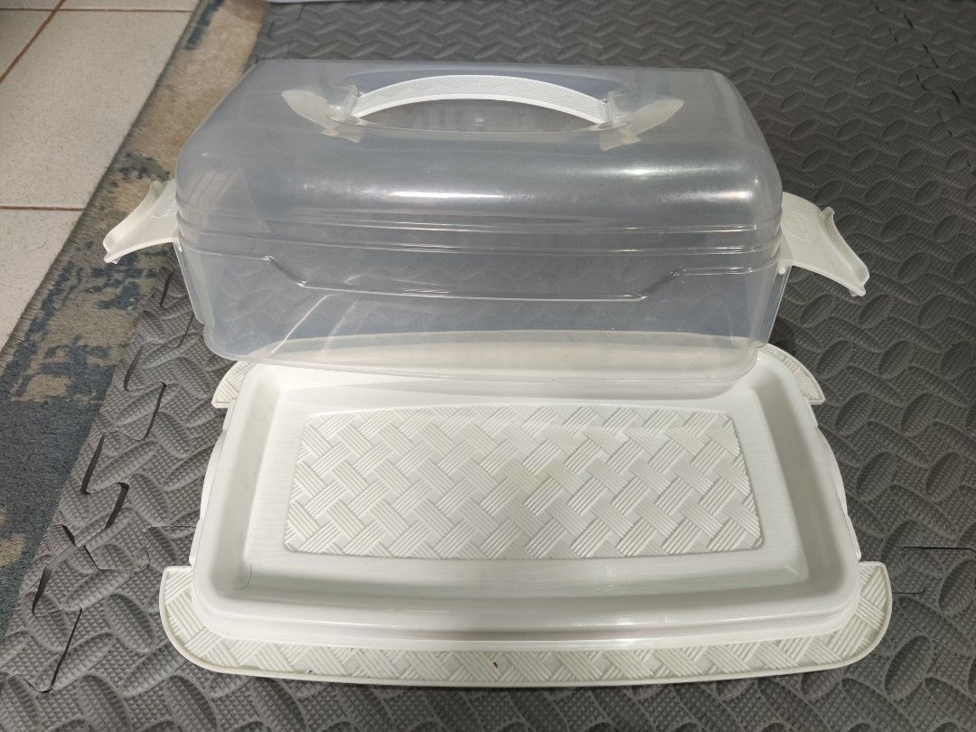 Clear Plastic Cake Carrier and Stackable Storage Bins (Category: Storage Boxes & Baskets) located in Caloocan City. Submitted by wadam9 (Listing ID 1441645609, Image 3). Description: - Clear plastic cake carrier with secure white base and lid. - Includes 6 stackable white storage bins. - 2-1 (take all) - Ideal for transporting cakes and pies. - Great for organizing kitchen or craft supplies. - Bins can be stacked together or used individually..