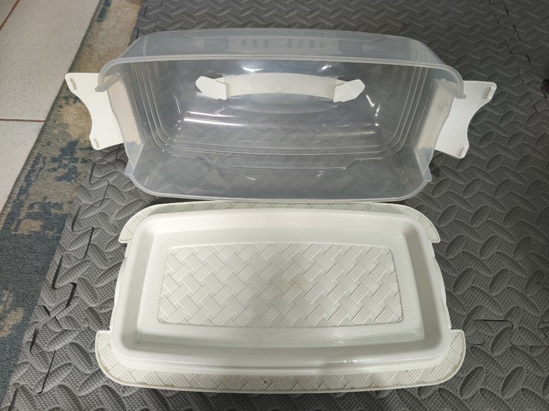 Clear Plastic Cake Carrier and Stackable Storage Bins (Category: Storage Boxes & Baskets) located in Caloocan City. Submitted by wadam9 (Listing ID 1441645609, Image 2). Description: - Clear plastic cake carrier with secure white base and lid. - Includes 6 stackable white storage bins. - 2-1 (take all) - Ideal for transporting cakes and pies. - Great for organizing kitchen or craft supplies. - Bins can be stacked together or used individually..