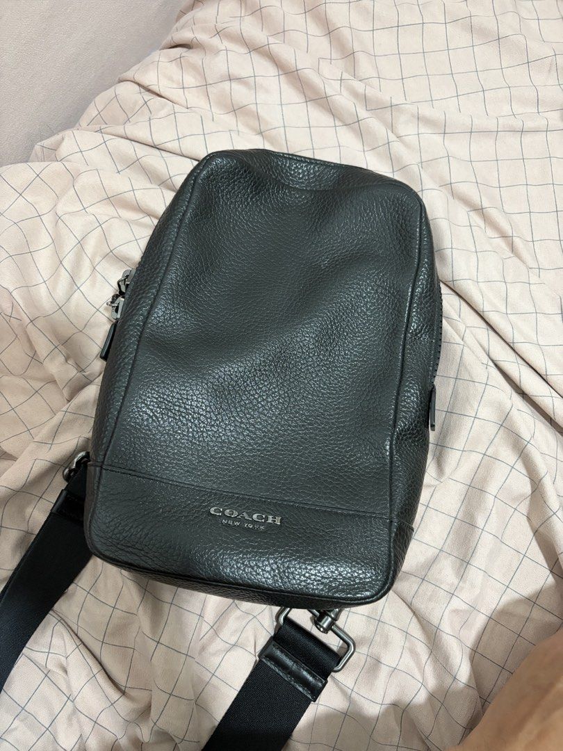 Coach Black Leather Sling Bag (Category: Luxury Bags & Wallets) located in Mandaluyong City. Submitted by getbounced (Listing ID 1441694368, Image 1). Description: - Authentic Coach black pebbled leather sling bag - Adjustable strap for comfortable wear - Spacious main compartment with secure zip closure - Padded mesh back for added comfort during use - Comes with original Coach leather tag - Ideal for everyday errands and activities.