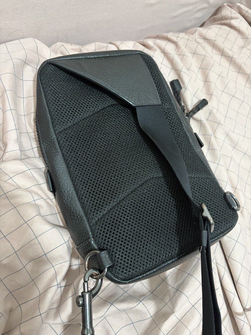 Coach Black Leather Sling Bag (Category: Luxury Bags & Wallets) located in Mandaluyong City. Submitted by getbounced (Listing ID 1441694368, Image 2). Description: - Authentic Coach black pebbled leather sling bag - Adjustable strap for comfortable wear - Spacious main compartment with secure zip closure - Padded mesh back for added comfort during use - Comes with original Coach leather tag - Ideal for everyday errands and activities.