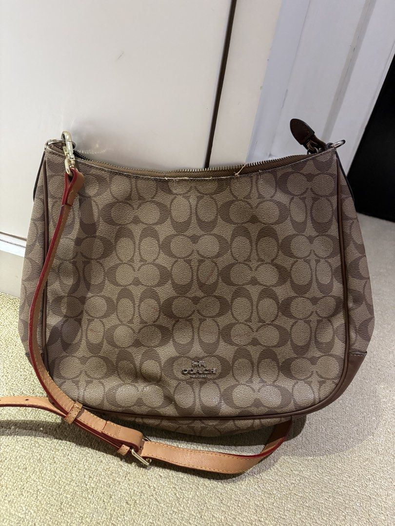 Coach Monogram sling Bag (Category: Luxury Bags & Wallets) located in Quezon. Submitted by squishymallows (Listing ID 1441610303, Image 1). Description: - Classic Coach monogram shoulder bag - Color: Brown and tan signature pattern - Material: Leather trim and strap - Closure: Zipper - Strap: Adjustable - Condition: Great everyday bag, shows some signs of wear on the strap and zipper. .