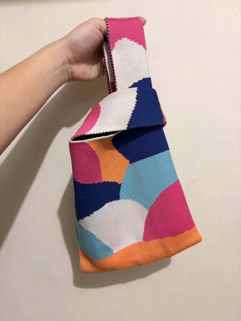 Colorful Geometric Knit Knot Bag (Category: Purses & Pouches) located in Mandaluyong City. Submitted by chynchilla (Listing ID 1441626214, Image 2). Description: - can be used/styled as knot or strapped cross body bag - chain strap included (a bit worn out on leather part) - no flaws on the bag itself.