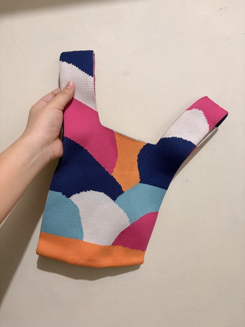 Colorful Geometric Knit Knot Bag (Category: Purses & Pouches) located in Mandaluyong City. Submitted by chynchilla (Listing ID 1441626214, Image 1). Description: - can be used/styled as knot or strapped cross body bag - chain strap included (a bit worn out on leather part) - no flaws on the bag itself.