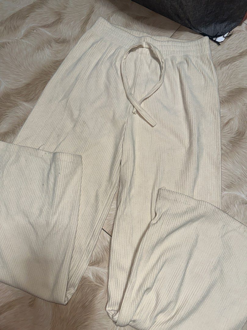 Cream Ribbed Wide Leg Pants with Drawstring Waist (Category: Other Bottoms) located in Manila. Submitted by abegailla22409 (Listing ID 1441592003, Image 1). Description: - Cream colored pants - Ribbed texture all over - Wide leg style - Adjustable drawstring waist - Super comfy and casual - Ideal for lounging or errands - Versatile pairing with any top.