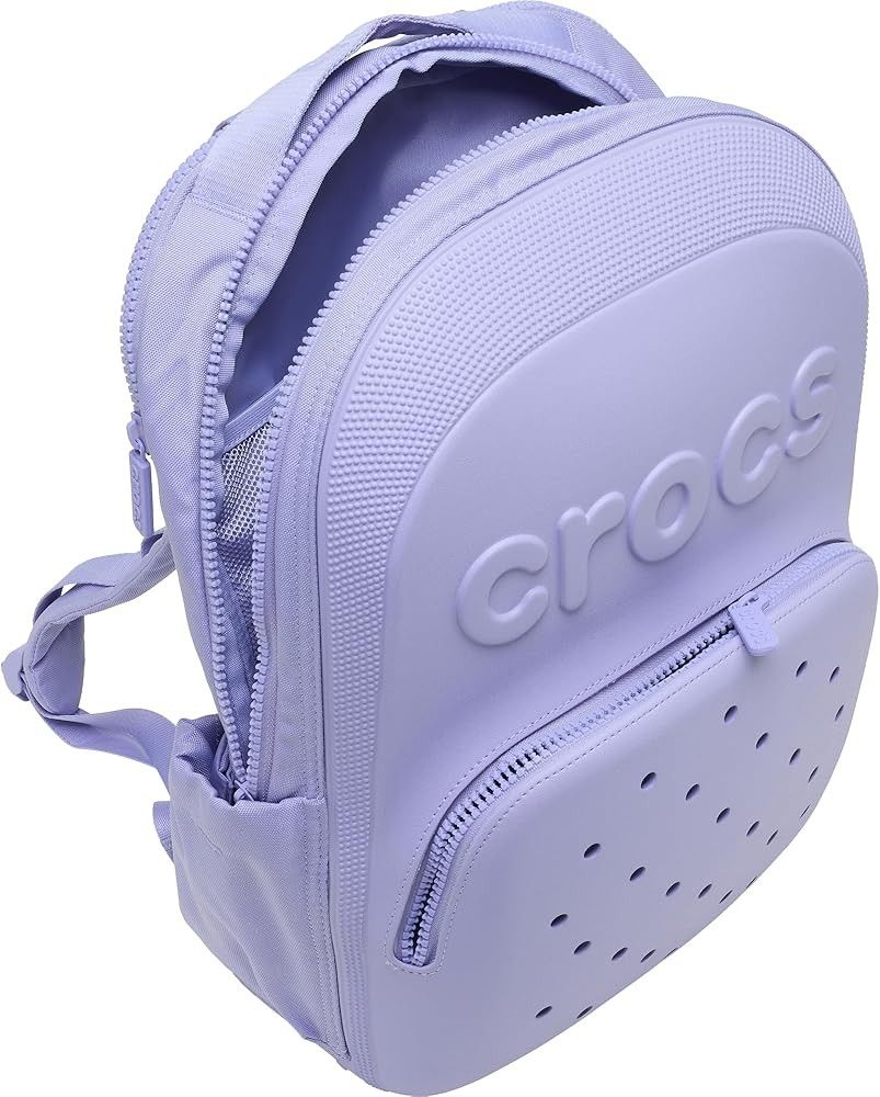 Crocs Lilac Purple Backpack with Jibbitz Holes (Category: Backpacks) located in Mandaluyong City. Submitted by mskitty_02 (Listing ID 1441747201, Image 3). Description: - Cool light purple Crocs backpack - Signature Crocs logo embossed on the front - Classic Jibbitz-style holes on the front pocket - Side pockets for water bottles or small items - Smooth zippers - Adjustable shoulder straps for comfort - Great for school or everyday use.