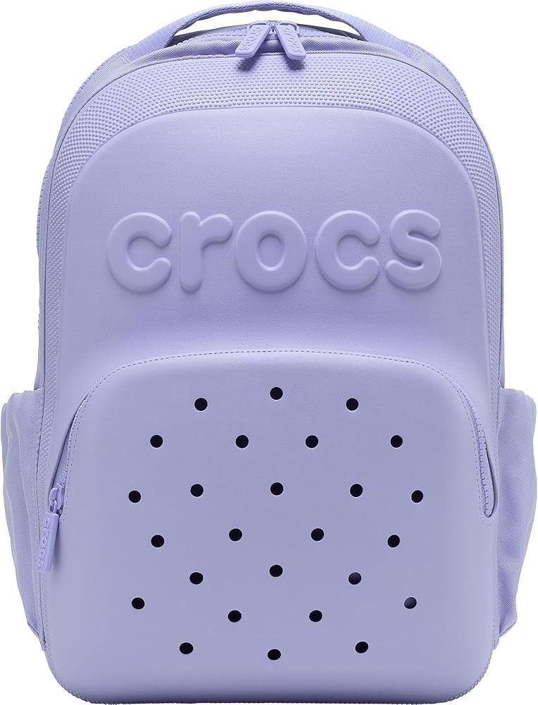 Crocs Lilac Purple Backpack with Jibbitz Holes (Category: Backpacks) located in Mandaluyong City. Submitted by mskitty_02 (Listing ID 1441747201, Image 1). Description: - Cool light purple Crocs backpack - Signature Crocs logo embossed on the front - Classic Jibbitz-style holes on the front pocket - Side pockets for water bottles or small items - Smooth zippers - Adjustable shoulder straps for comfort - Great for school or everyday use.