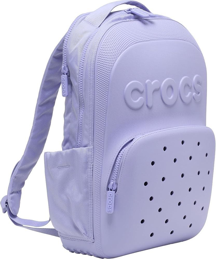 Crocs Lilac Purple Backpack with Jibbitz Holes (Category: Backpacks) located in Mandaluyong City. Submitted by mskitty_02 (Listing ID 1441747201, Image 2). Description: - Cool light purple Crocs backpack - Signature Crocs logo embossed on the front - Classic Jibbitz-style holes on the front pocket - Side pockets for water bottles or small items - Smooth zippers - Adjustable shoulder straps for comfort - Great for school or everyday use.