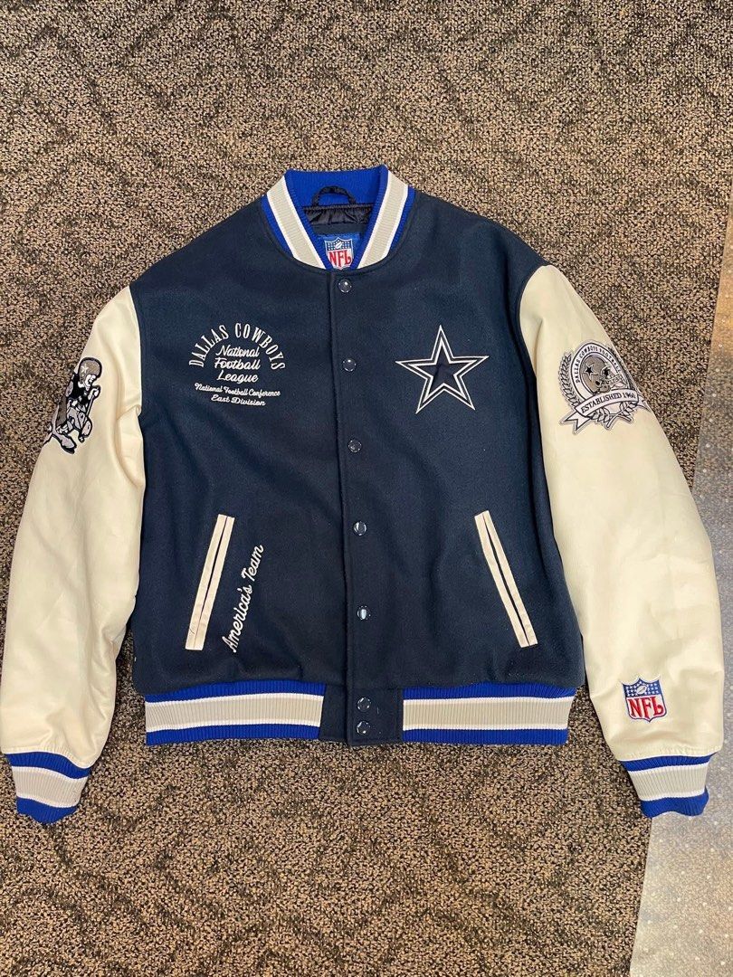 Dallas Cowboys NFL Varsity Jacket (Category: Coats, Jackets and Outerwear) located in Caloocan City. Submitted by puremountain.2e6573 (Listing ID 1441742596, Image 1). Description: - Classic Dallas Cowboys varsity jacket - Navy blue body with cream sleeves - Features embroidered team logos - 'America's Team' text detail - Lined interior for added warmth - Ideal for any Cowboys fan.