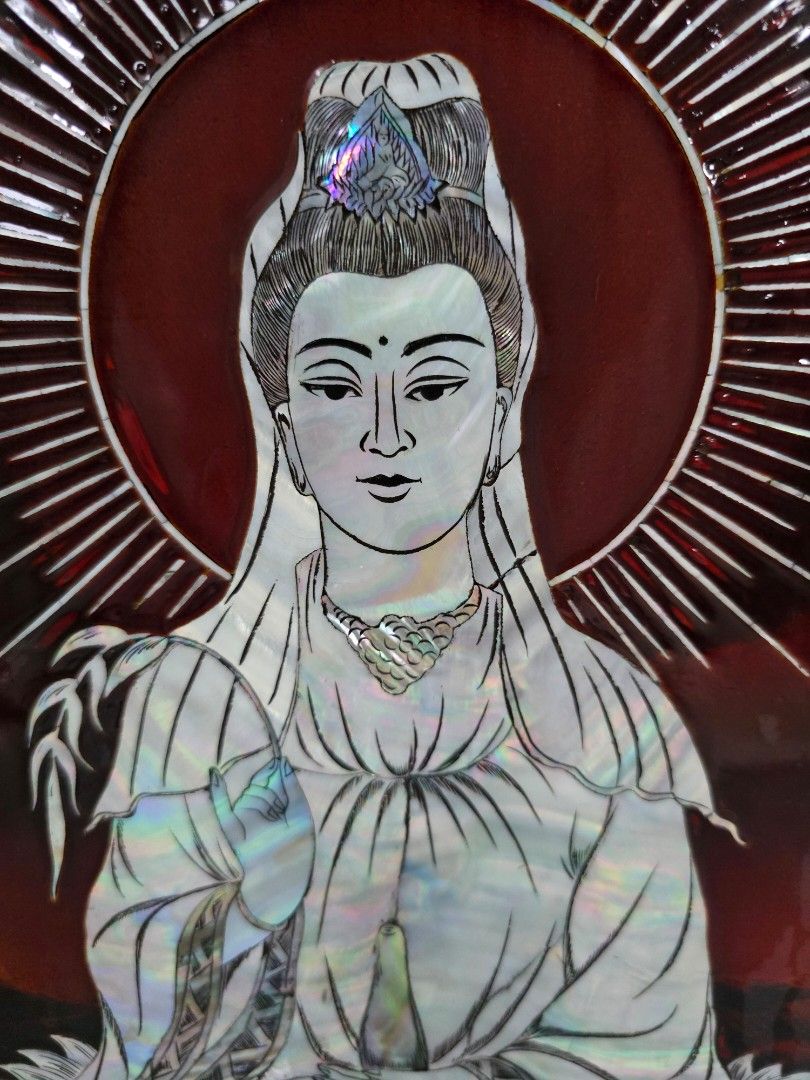 Decor (Category: Wall Decor) located in Singapore. Submitted by dorothyye05321 (Listing ID 1441751741, Image 2). Description: - Exquisite wall art featuring a mother-of-pearl inlay of Guan Yin. - Serene depiction with a radiant halo against a deep red background. - Dimensions: 40cm (width) x 60cm (height). - Adds elegance and tranquility to any home. - Intricate craftsmanship and beautiful detailing..