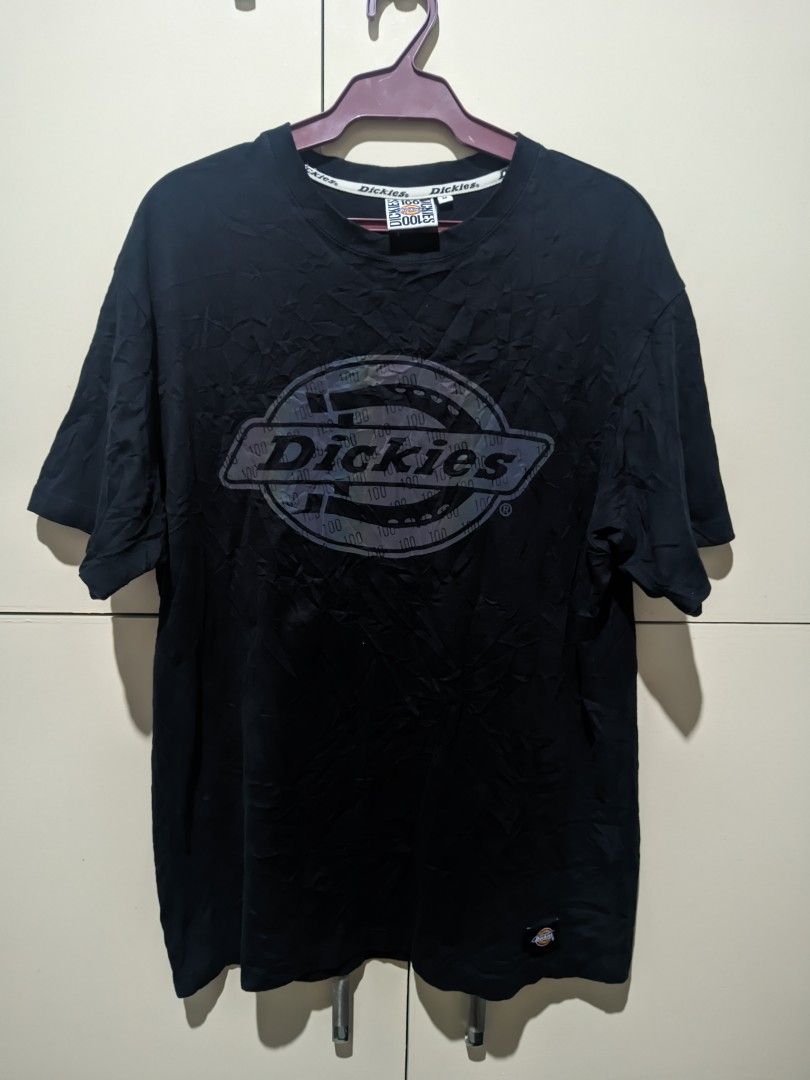 Dickies Black T-Shirt Size M (Category: Tshirts & Polo Shirts ) located in Calapan. Submitted by ideals_06 (Listing ID 1441712282, Image 1). Description: - Classic Dickies logo with a vibrant tie-dye effect - Features a bold '100' print - Made from 100% comfortable cotton - Size Medium -Can fit to large - Ideal for everyday casual wear.