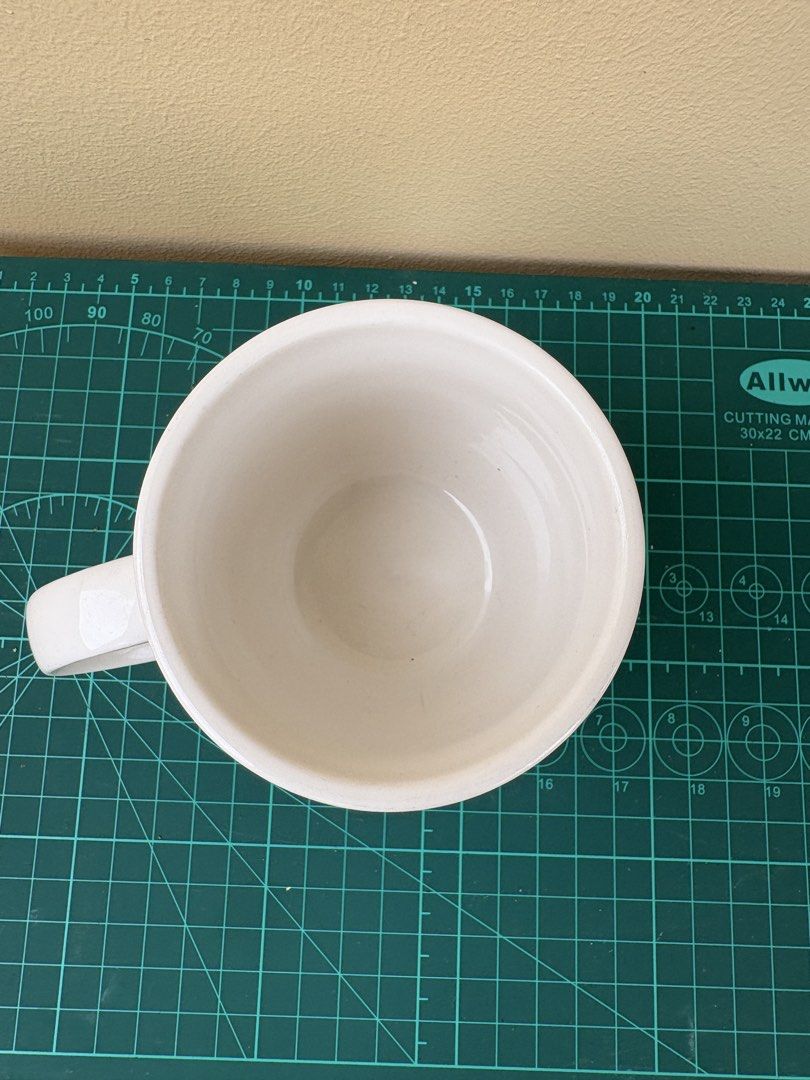 Dunkin' Cafe White Ceramic Coffee Mug (Category: Coffee & Tea Tableware) located in Antipolo. Submitted by anabri (Listing ID 1441678940, Image 3). Description: - White ceramic mug from Dunkin' Cafe - Features the iconic Dunkin' logo - Sturdy handle for a comfortable grip - See photos for details.