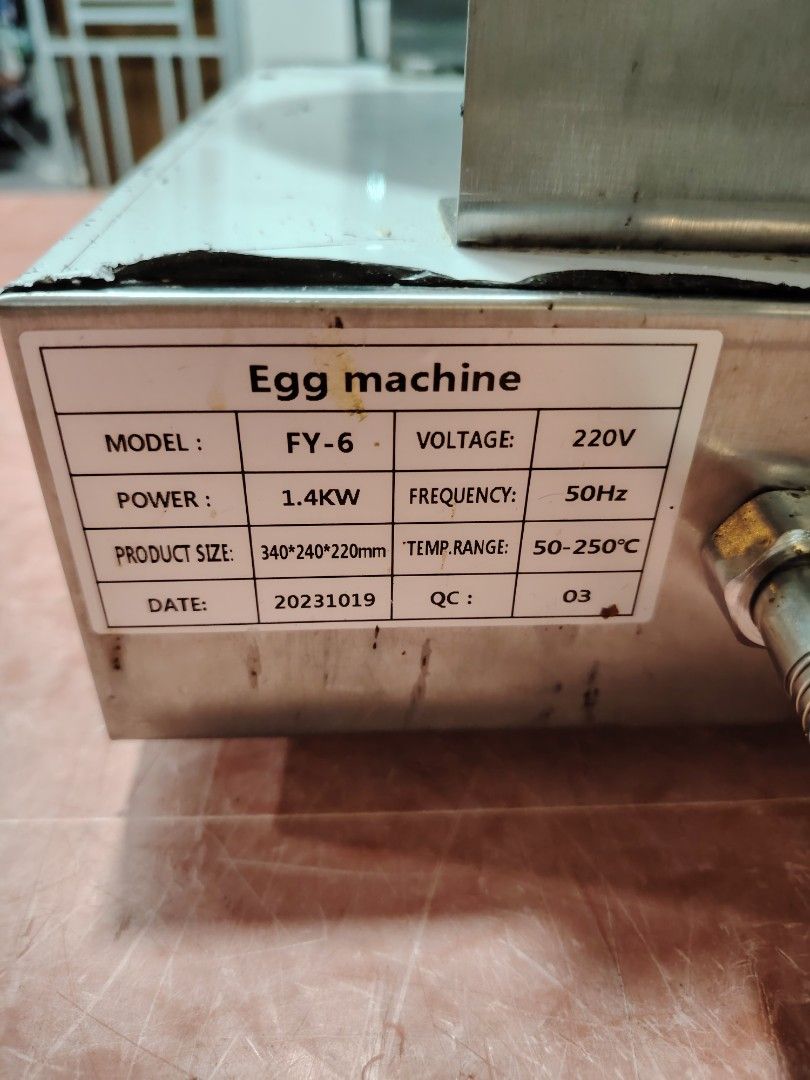 Egg Waffle Maker (Category: Other Kitchen Appliances) located in Kuala Lumpur. Submitted by livewater.b5a3dc (Listing ID 1441641765, Image 3). Description: - Commercial Egg Waffle Maker (Model FY-6) - Power: 220V, 1.4KW - Temperature Control: 50-250°C - Dimensions: 340mm x 240mm x 220mm - Ideal for Bubble Waffles & Egg Tarts - Features an easy-to-use wooden handle.