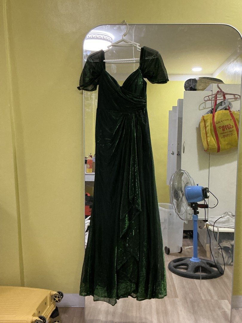 Emerald Green Off-Shoulder Ruched Gown (Category: Evening dresses & gowns) located in Quezon City. Submitted by dwynhnd (Listing ID 1441736878, Image 1). Description: - Beautiful emerald green gown - Off-shoulder design with ruched detailing - Subtle shimmer in the fabric - Floor length - Ideal for formal events or parties - Worn only once for a special occasion.