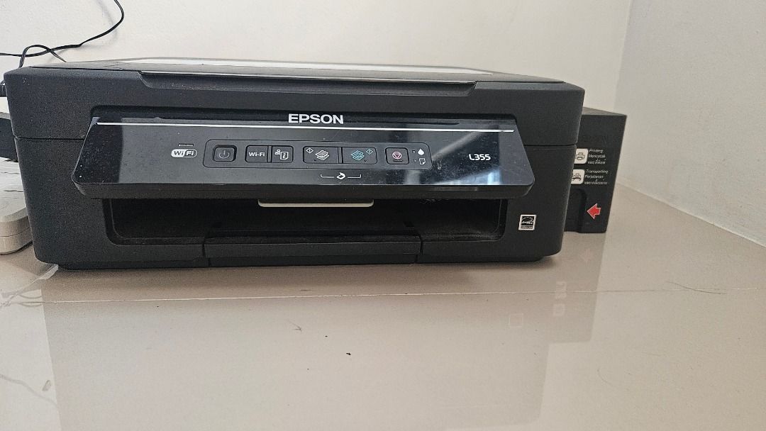 Epson L355 All-in-One Ink Tank Printer Scanner Copier (Category: Printers, Scanners & Copiers) located in Malabon City. Submitted by joshmangunay (Listing ID 1441665598, Image 3). Description: - Epson L355 All-in-One Printer - Functions: Print, Scan, Copy - Features: Cost-saving ink tank system - Includes: Power cable, data cable - Condition: Ready for a new home Printing pa din pero malabo. Maybe you can have it cleaned. No time. -Baka madumi la