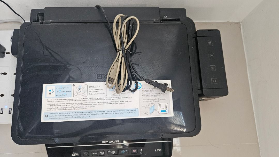 Epson L355 All-in-One Ink Tank Printer Scanner Copier (Category: Printers, Scanners & Copiers) located in Malabon City. Submitted by joshmangunay (Listing ID 1441665598, Image 2). Description: - Epson L355 All-in-One Printer - Functions: Print, Scan, Copy - Features: Cost-saving ink tank system - Includes: Power cable, data cable - Condition: Ready for a new home Printing pa din pero malabo. Maybe you can have it cleaned. No time. -Baka madumi la