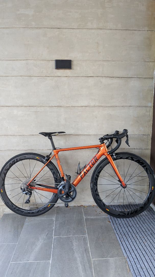 FACTOR O2 Road Bike Full Carbon (Category: Bicycles) located in Manila. Submitted by manilacloset (Listing ID 1441661865, Image 1). Description: FS: FACTOR O2 RIM BRAKE ROAD BIKE Low mileage used for Coffee Rides only Frame size: 49; orange colorway Headtube: Ceramicspeed Bottom Bracket: Ceramicspeed Complete Groupset: Shimano Ultegra Saddle - Selle Italia SLR Seatpost - Enve Carbon Wheelset: Mavic Cosmic Tires: Continental 5000 Stem - Zipp Servi