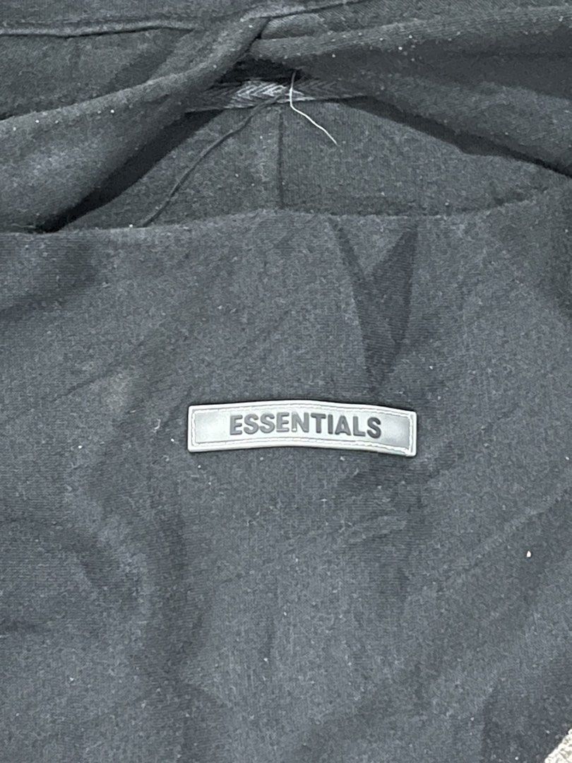 Fear of God Essentials Black Hoodie Reflectorized (Category: Hoodies) located in Manila. Submitted by joshua_hq (Listing ID 1441688140, Image 2). Description: - Authentic Fear of God Essentials hoodie - Features the signature Essentials logo on the chest and sleeve - Large, eye-catching Essentials graphic on the back - Designed for ultimate comfort and style - Ideal for casual everyday wear - 25 length - 24 width - negotiable .