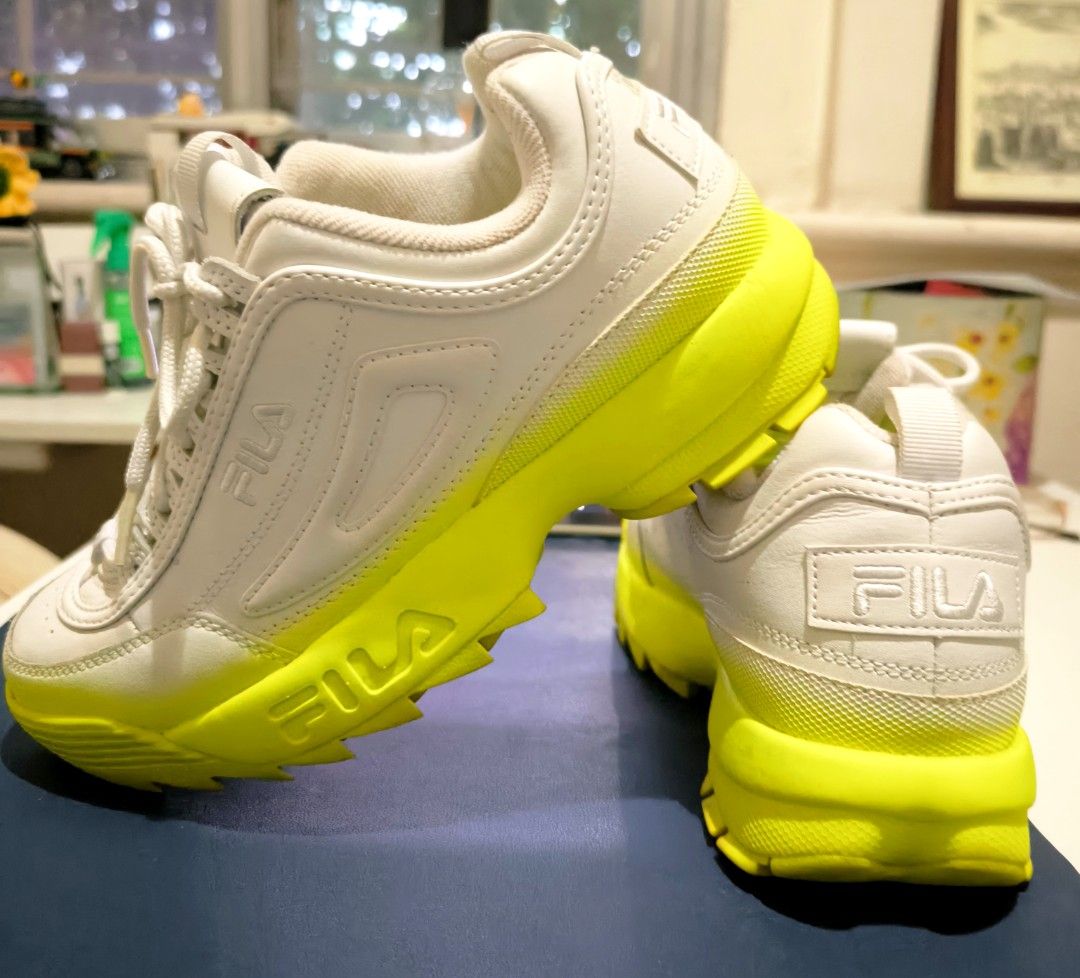 FILA Disruptor II "Brights Fade" (Category: Sneakers) located in San Juan City. Submitted by nagd. (Listing ID 1441699775, Image 2). Description: Size 25.5cm (8.5US) 39.5Euro San Juan City Rfs : decluttering FILA Disruptor II "Brights Fade". This model is a variation of the iconic chunky "dad shoe" featuring a distinctive neon color gradient. Colorway: Primarily white leather upper that "fades" into a vibrant Neon Yellow (also referred to as Safe
