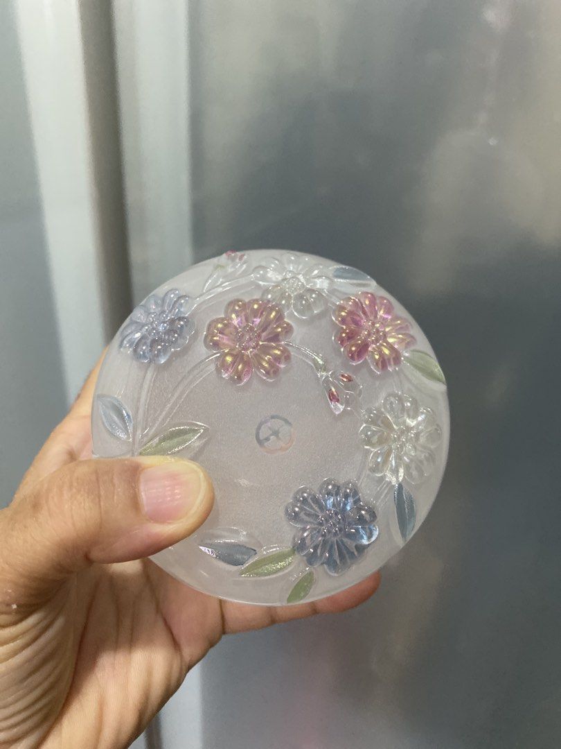 Frosted Glass Jar with Floral Embossing (Category: Vases & Decorative Bowls) located in Muntinlupa City. Submitted by lay_away_ok (Listing ID 1441588862, Image 3). Description: - Frosted glass jar - Beautiful floral embossing with pink, blue, and clear flowers - Subtle floral etching inside - Ideal for storing small trinkets - Doubles as a decorative piece .