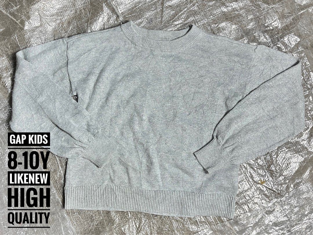 GAP Kids Grey Sweater 8-10Y (Category: Babies & Kids Fashion) located in Nabua. Submitted by siri14 (Listing ID 1441694855, Image 1). Description: - GAP Kids Grey Sweater - Size: 8-10 years - Long sleeves with ribbed cuffs - Mock neck with ribbed collar - Ribbed hem - High-quality knit - Perfect for everyday wear.