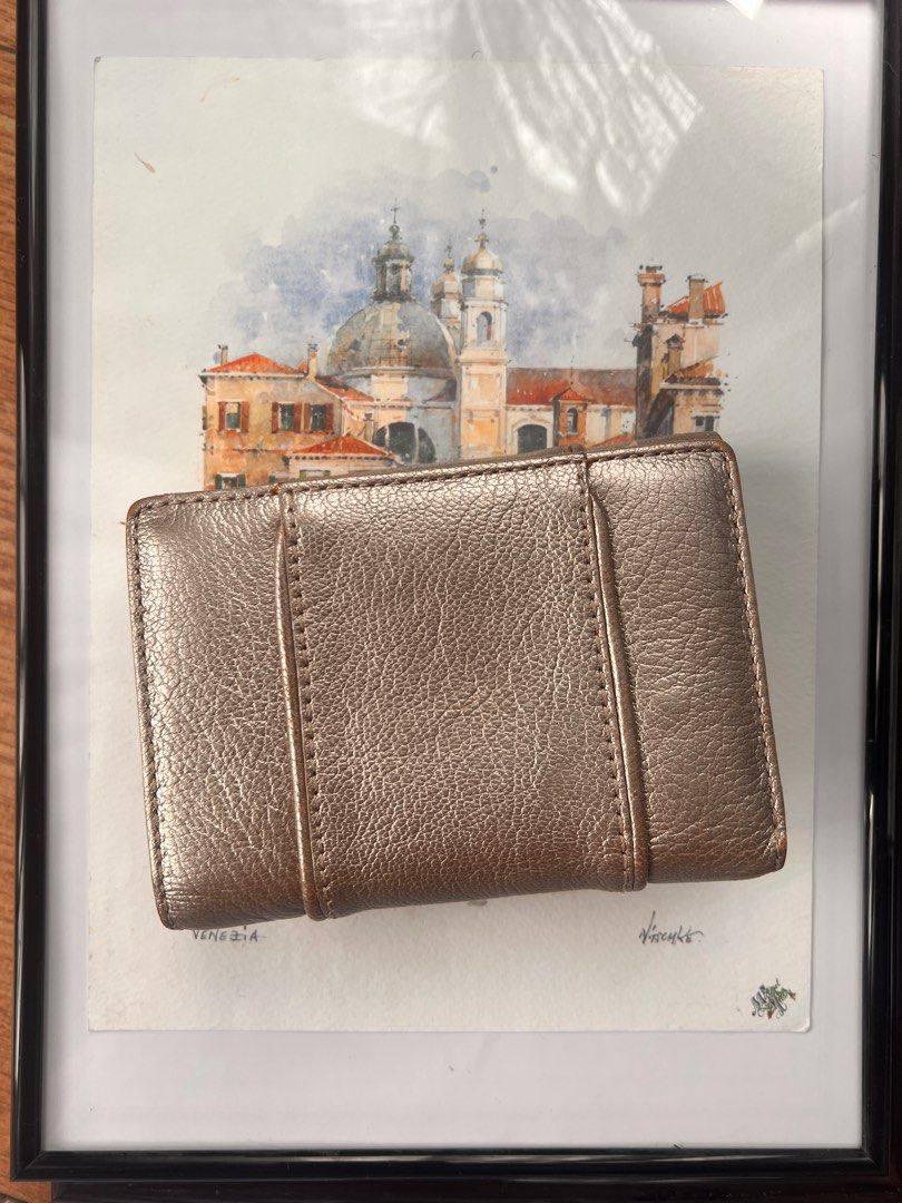 Givenchy Metallic Leather Billfold Wallet (Category: Luxury Bags & Wallets) located in Pasig City. Submitted by curatedbywill (Listing ID 1441645705, Image 2). Description: - Authentic Givenchy wallet (circa 2008-2010) - Metallic bronze leather - Bi-fold design with snap closure - Multiple interior card slots - Clear ID window - Comes with original box and wrapping paper - Ideal for everyday use - BOUGHT THE ITEM FROM RAGTAG IN OMOTESANDO, TOKYO 