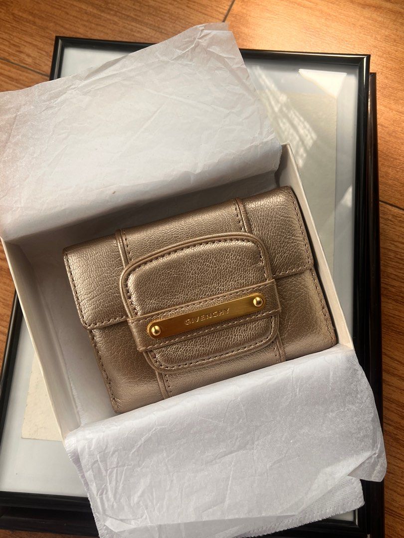 Givenchy Metallic Leather Billfold Wallet (Category: Luxury Bags & Wallets) located in Pasig City. Submitted by curatedbywill (Listing ID 1441645705, Image 1). Description: - Authentic Givenchy wallet (circa 2008-2010) - Metallic bronze leather - Bi-fold design with snap closure - Multiple interior card slots - Clear ID window - Comes with original box and wrapping paper - Ideal for everyday use - BOUGHT THE ITEM FROM RAGTAG IN OMOTESANDO, TOKYO 