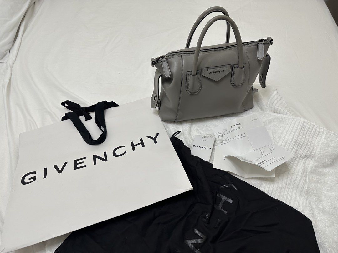Givenchy Pearl Grey Smooth Leather Small Antigona Soft Bag (Category: Luxury Bags & Wallets) located in Paranaque City. Submitted by innersmile (Listing ID 1441742913, Image 1). Description: - Authentic Grey Leather Givenchy Antigona - Includes Original Dust Bag, Shopping Bag, Cards and Receipt - Features Top Handles and Detachable Shoulder Strap - Silver-Toned Hardware - Bought in SG for 2990 SGD yr 2022 Rfs- decluttering - Steal deal!.