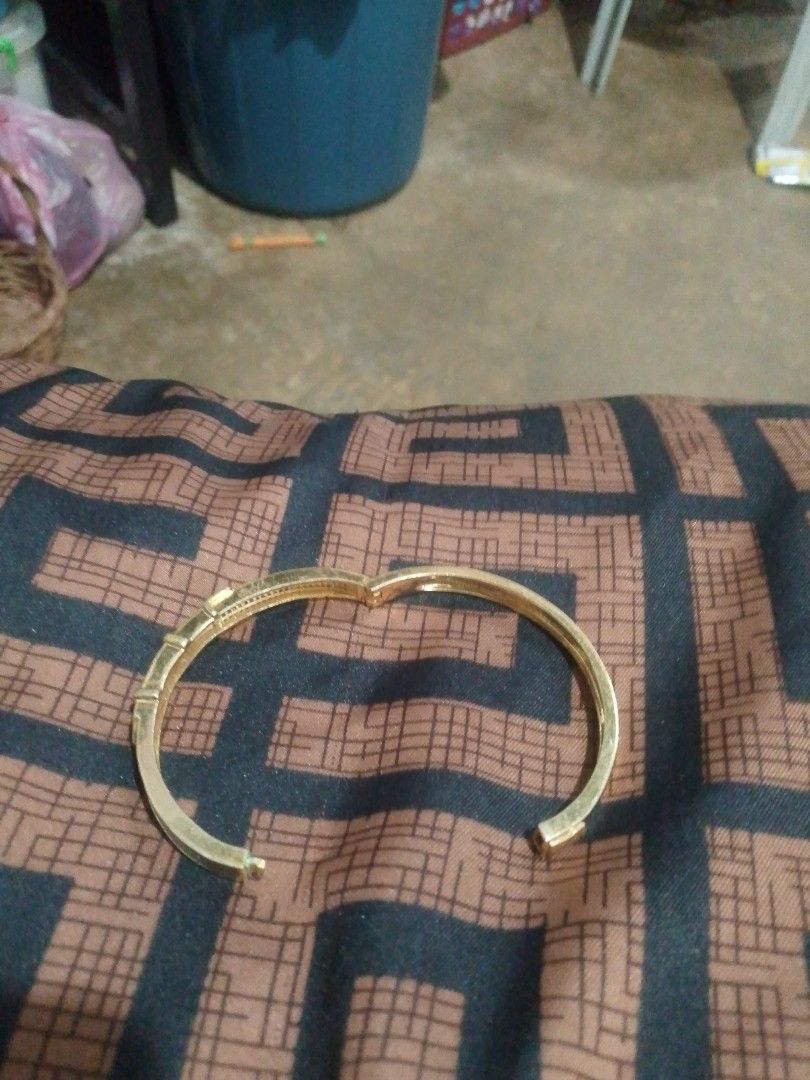 Gold Tone Bangle Bracelet with Rhinestones (Category: Bracelets) located in Manila. Submitted by epicwind_1bf746 (Listing ID 1441757243, Image 3). Description: - Gold tone bangle bracelet - Unique belt buckle design - Adorned with clear stones all around - Perfect for dressing up your look - Approx. 2.5 inches in diameter - Secure and reliable clasp - Shiny and eye-catching piece.
