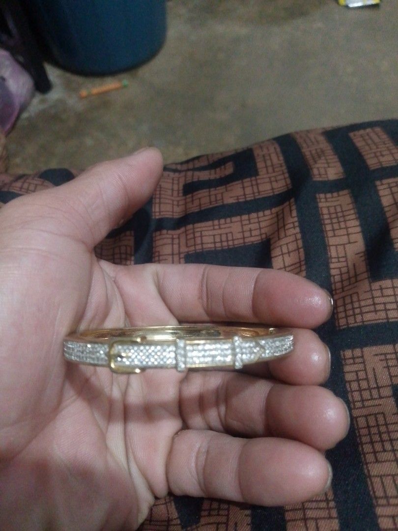 Gold Tone Bangle Bracelet with Rhinestones (Category: Bracelets) located in Manila. Submitted by epicwind_1bf746 (Listing ID 1441757243, Image 1). Description: - Gold tone bangle bracelet - Unique belt buckle design - Adorned with clear stones all around - Perfect for dressing up your look - Approx. 2.5 inches in diameter - Secure and reliable clasp - Shiny and eye-catching piece.