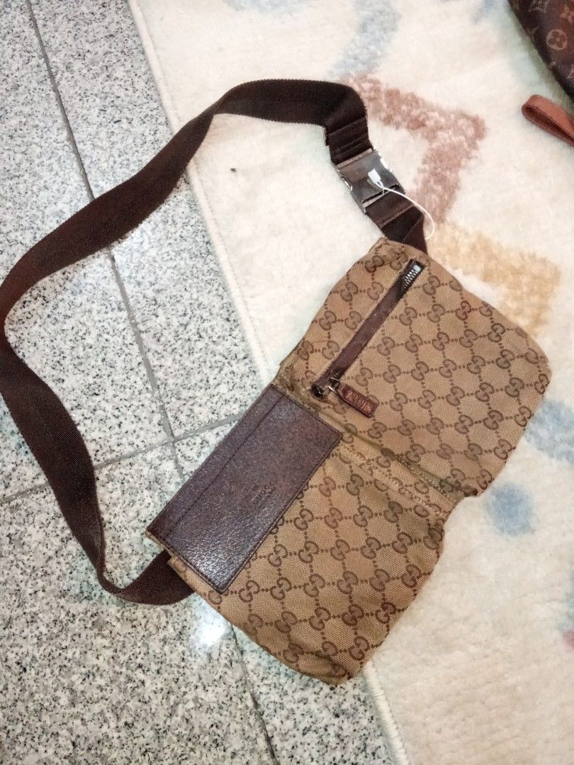 Gucci GG Monogram Canvas Waist Bag (Category: Luxury Bags & Wallets) located in Manila. Submitted by christoph17 (Listing ID 1441680926, Image 1). Description: - Authentic Gucci waist bag - Classic GG monogram canvas - Brown leather trim and strap - Zipper closure - Metal buckle with Gucci logo - Ideal for carrying essentials.