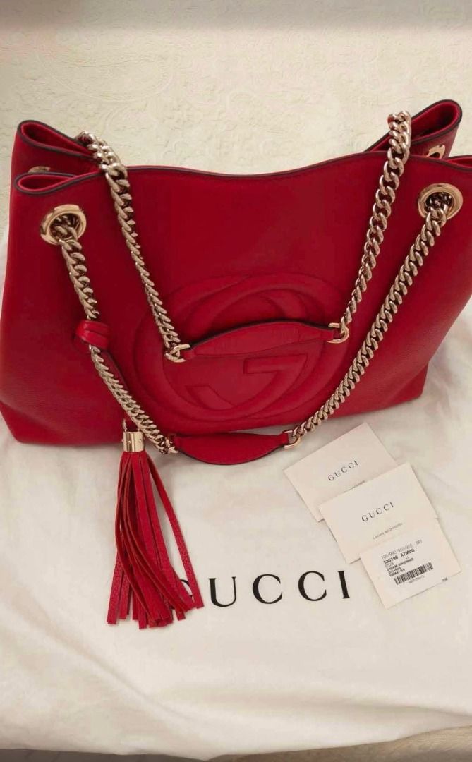 Gucci Red Leather Chain Shoulder Bag (Category: Luxury Bags & Wallets) located in Rizal. Submitted by magracias (Listing ID 1441702663, Image 3). Description: - Authentic Red Leather Gucci Soho Bag - Iconic Embossed Interlocking G Logo - Gold-Tone Chain Strap - Signature Tassel Detail - Interior Zip Pocket and Slip Pocket - Comes with Dust Bag and Authenticity Cards - Bought from Belgium.