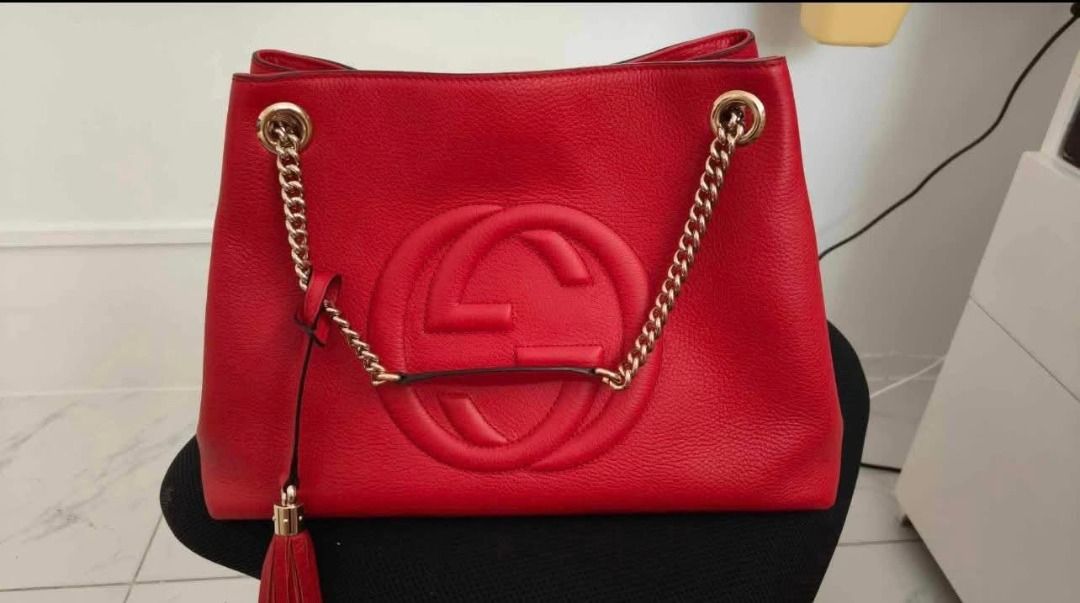 Gucci Red Leather Chain Shoulder Bag (Category: Luxury Bags & Wallets) located in Rizal. Submitted by magracias (Listing ID 1441702663, Image 1). Description: - Authentic Red Leather Gucci Soho Bag - Iconic Embossed Interlocking G Logo - Gold-Tone Chain Strap - Signature Tassel Detail - Interior Zip Pocket and Slip Pocket - Comes with Dust Bag and Authenticity Cards - Bought from Belgium.