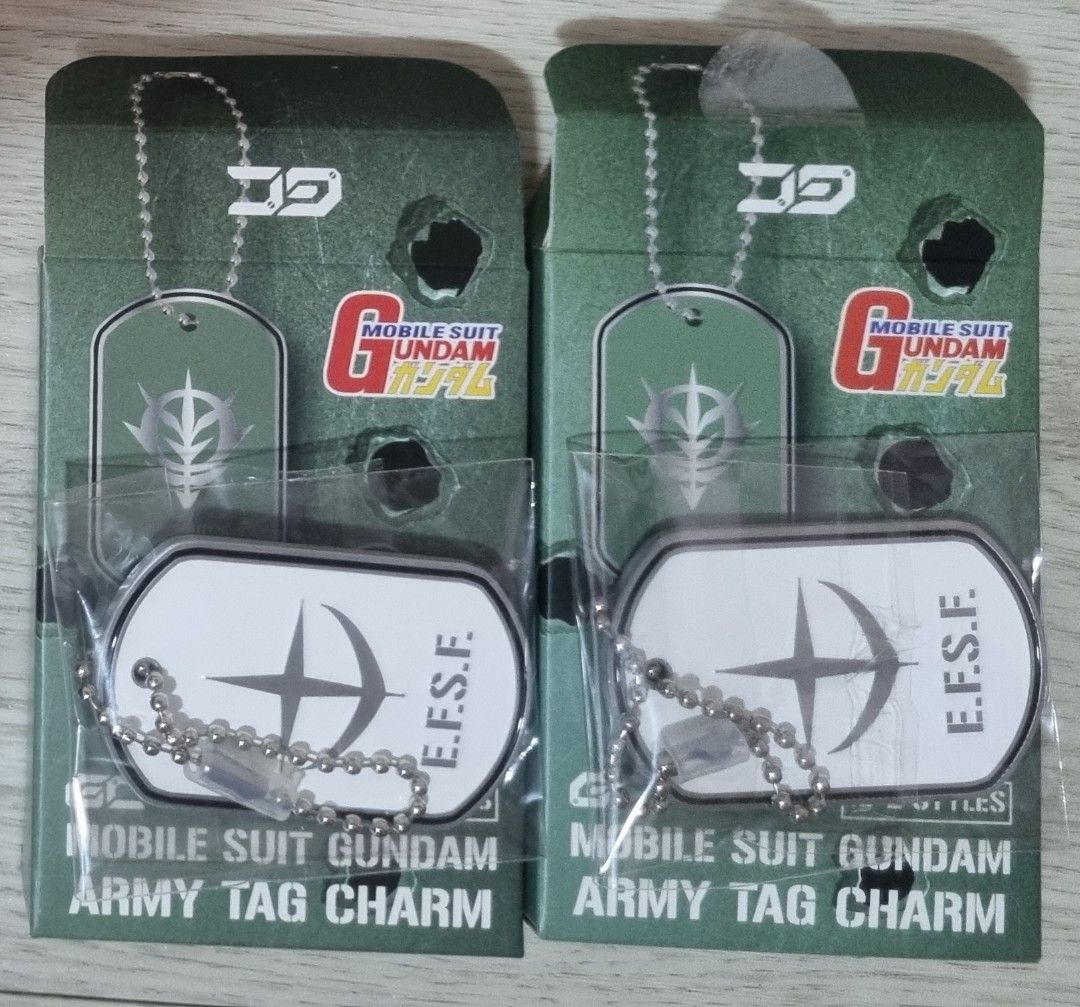 Gundam Army Tag Charm RX-78-2 & RX-77-2 (Category: J-Wave Merchandise) located in Singapore. Submitted by andy.ong.5243 (Listing ID 1441713771, Image 2). Description: - Set of 2 Mobile Suit Gundam Army Tag Charms - Includes RX-78-2 Gundam and RX-77-2 Guncannon designs - Features E.F.S.F. (Earth Federation Space Force) branding - Brand new in original packaging - Ideal for Gundam fans and collectors.