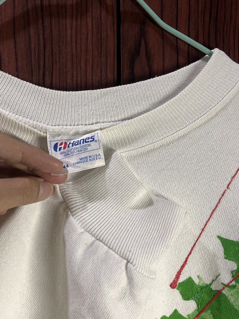 Hanes White Christmas Sweatshirt (Category: Coats, Jackets and Outerwear) located in Manila. Submitted by chiyooo787 (Listing ID 1441752093, Image 3). Description: 24L by 22.5W Brand: Hanes Color rate: 9/10 Issue: crack green and red prints rfs: too small on me now +sf for buyers.
