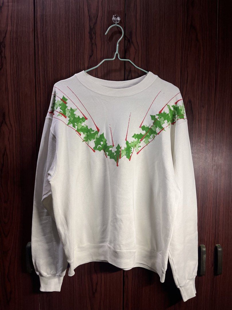 Hanes White Christmas Sweatshirt (Category: Coats, Jackets and Outerwear) located in Manila. Submitted by chiyooo787 (Listing ID 1441752093, Image 1). Description: 24L by 22.5W Brand: Hanes Color rate: 9/10 Issue: crack green and red prints rfs: too small on me now +sf for buyers.