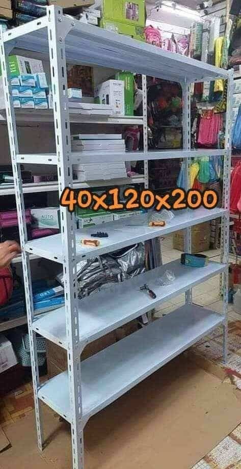 Heavy Duty Metal Shelving Unit Storage Rack (Category: Shelves, Cabinets & Racks) located in Caloocan City. Submitted by swiftflower_802790 (Listing ID 1441707690, Image 1). Description: - Sturdy metal shelving unit - Perfect for home or garage organization - Color: White - Available Sizes: 40x120x200 cm and 30x70x150 cm - Easy to assemble - Strong and durable.