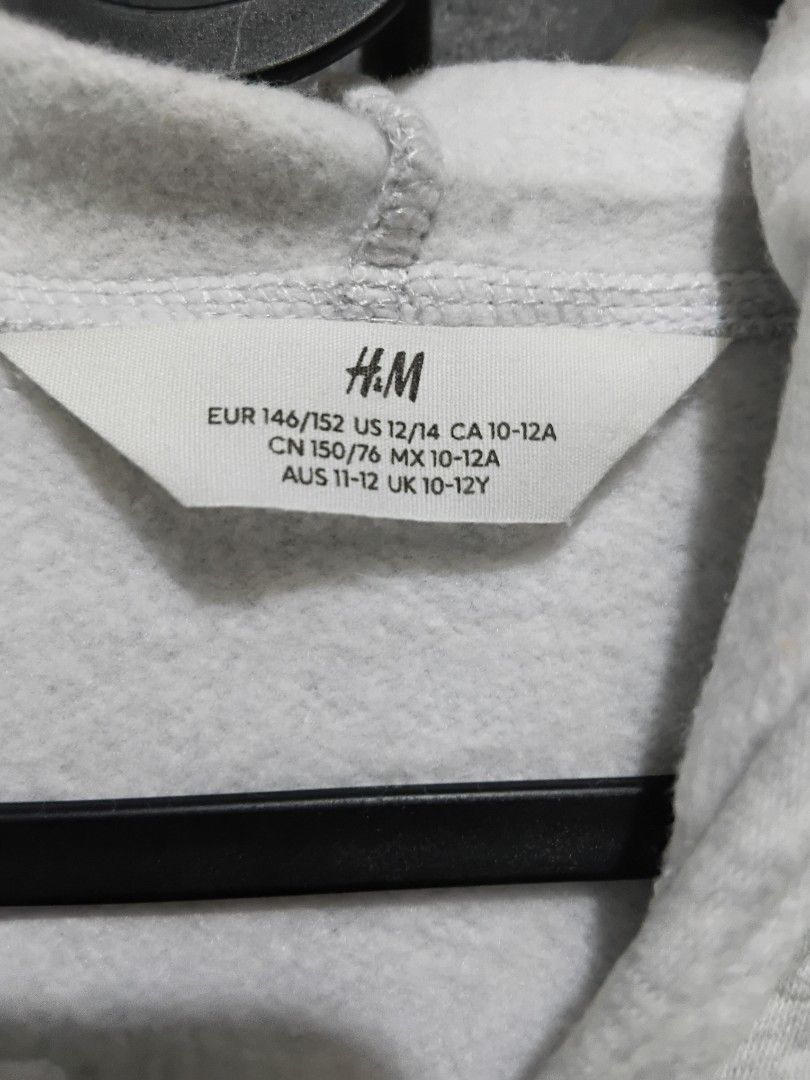 H&M Grey Zip-Up Hoodie (Category: Babies & Kids Fashion) located in Manila. Submitted by ramcyanthony (Listing ID 1441772248, Image 2). Description: - Grey zip-up hoodie from H&M - Kids size 10-12 years - width 18in length 24in - Features convenient front pockets .