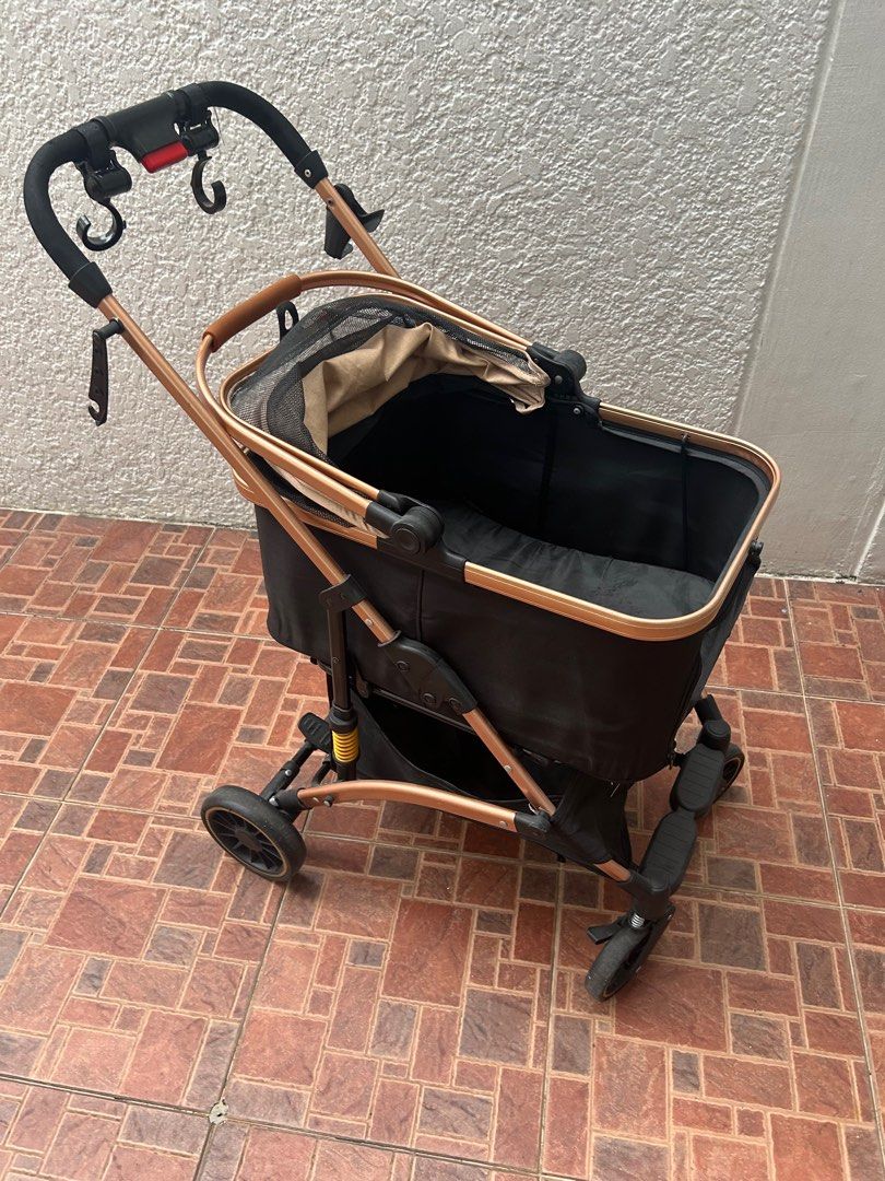 HYUGO Pet Stroller - Rose Gold & Black (Category: Homes & Other Pet Accessories) located in Quezon City. Submitted by etelin (Listing ID 1441753562, Image 2). Description: Pre-loved - Hyugo Charlie Pet Stroller Black Basket Size: 55x33x46cm Product Features and Details: 1. Spacious Basket: Offers a cozy space for your pet with a basket size of 55x33x46cm, providing ample room for comfort. 2. One-Click Stowage: Folds effortlessly for easy storage 