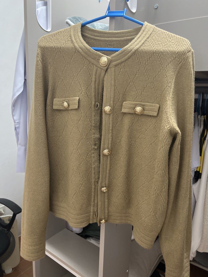 Khaki Textured Cardigan with Gold Buttons (Category: Coats, Jackets and Outerwear) located in Davao. Submitted by amdeclutterrr (Listing ID 1441661867, Image 1). Description: Bought from thailand - Khaki textured cardigan - Features gold buttons on front and pockets - Round neckline - Long sleeves with ribbed cuffs - Versatile for wearing buttoned up or open - Perfect for layering.