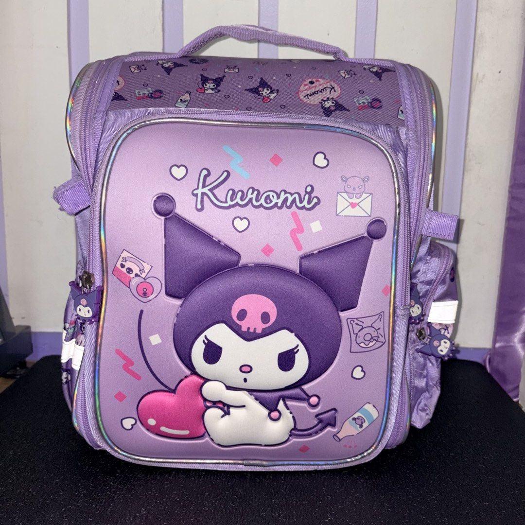 Kuromi Purple kids school backpack (Category: Backpacks) located in Manila. Submitted by danekb (Listing ID 1441762364, Image 1). Description: -all zippers working -minimal ink pen stains -main zipper zips/unzips all the way -has back padding height - approx 38cm / 15 in length (thickness when stuffed) - approx 25 cm / 10 in width - approx 36 cm / 14 in .