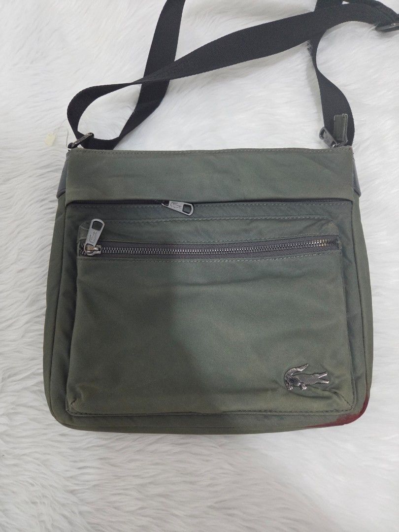 Lacoste Green Nylon Crossbody Bag (Category: Sling Bags) located in Bulacan. Submitted by farfinfab (Listing ID 1441585764, Image 2). Description: preloved original lacoste crossbody bag has red stain from pentel pen sa bottom j&t .