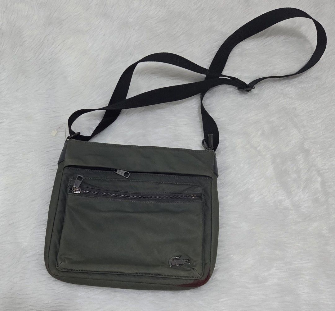 Lacoste Green Nylon Crossbody Bag (Category: Sling Bags) located in Bulacan. Submitted by farfinfab (Listing ID 1441585764, Image 3). Description: preloved original lacoste crossbody bag has red stain from pentel pen sa bottom j&t .