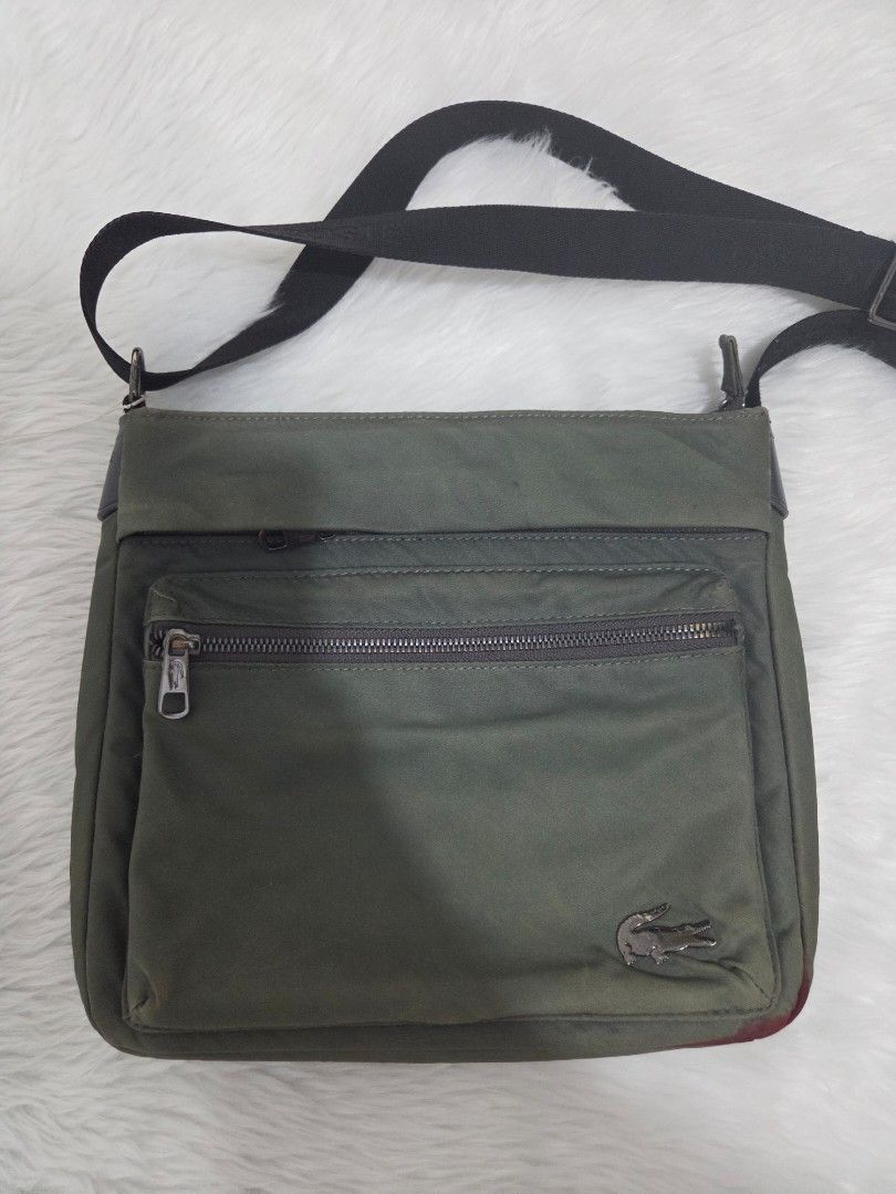 Lacoste Green Nylon Crossbody Bag (Category: Sling Bags) located in Bulacan. Submitted by farfinfab (Listing ID 1441585764, Image 1). Description: preloved original lacoste crossbody bag has red stain from pentel pen sa bottom j&t .