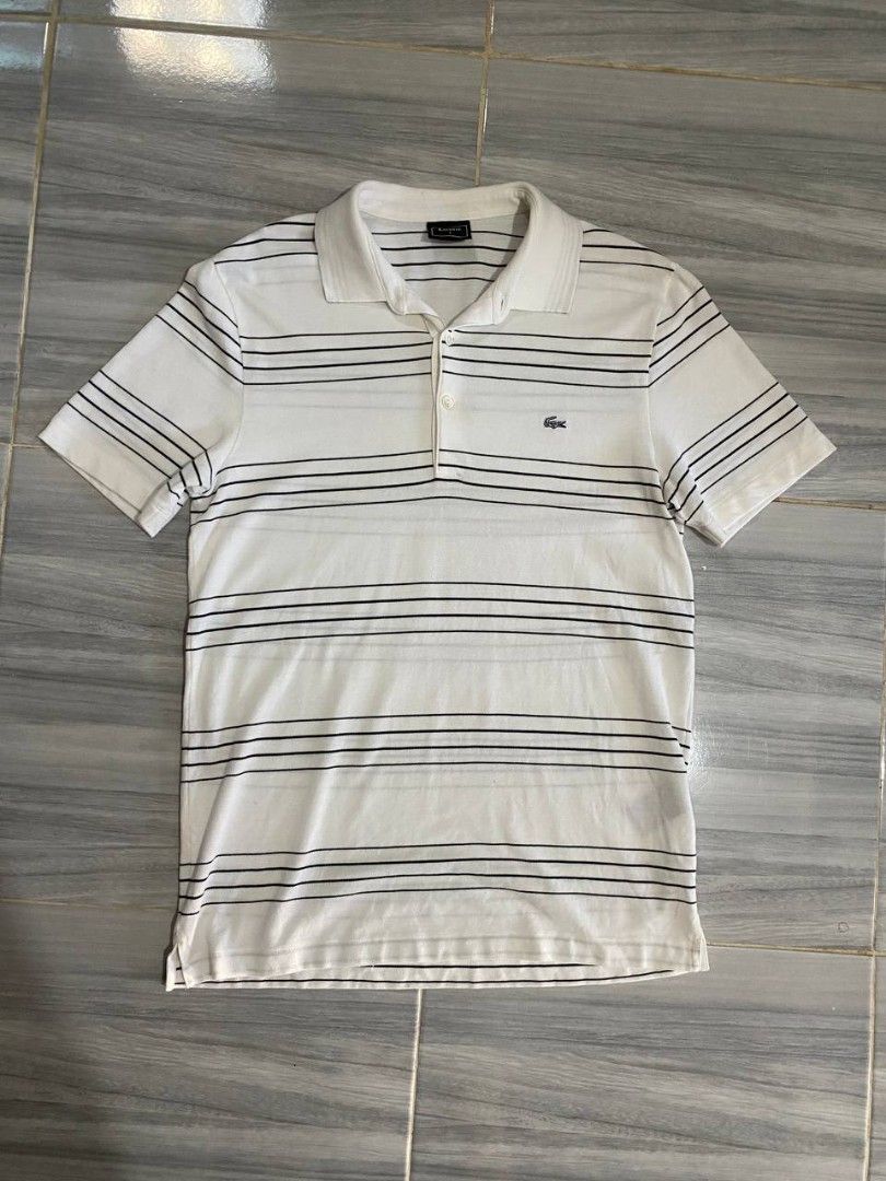 Lacoste Polo Shirt With Thin Black Stripes (Category: Tshirts & Polo Shirts ) located in Manila. Submitted by ejhyyy (Listing ID 1441710138, Image 1). Description: LACOSTE POLO SHIRT AUTHENTIC AS NEW CONDITION 10/10 COLOR RATE NO ISSUES.